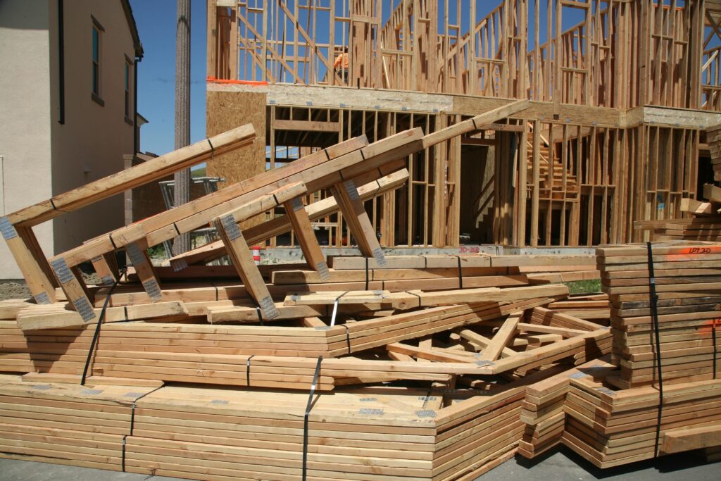 Wood supports sitting on a construction site. 